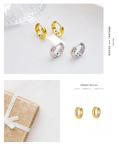 Detail of minimalist gold and silver hoop earrings in a premium gift packaging box