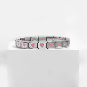 Italian charm bracelet in stainless steel with pink enamel heart links on white pedestal