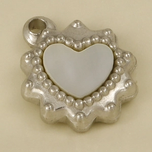 Macro view of a 304 stainless steel heart pendant with white shell inlay and silver loop