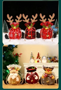 Detail of Christmas apple gift bags with reindeer antlers and festive doll patterns