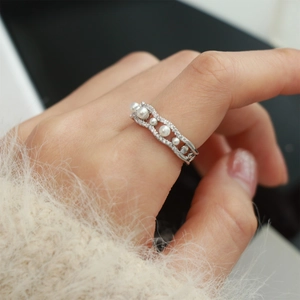 Elegant silver wave open ring with white faux pearls and sparkling pavé crystals