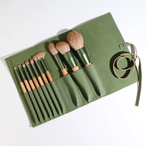 12-piece professional makeup brush set with green wood handles in a fabric roll-up pouch