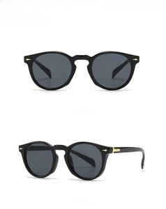 Front and 45-degree side view of black vintage sunglasses with golden arrow metal rivets