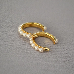Elegant gold-plated C-shaped hoop earrings with faux pearl embellishments for women