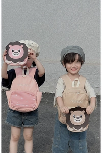 Pink and khaki kids lion backpack set with cute 3D ears on a neutral background