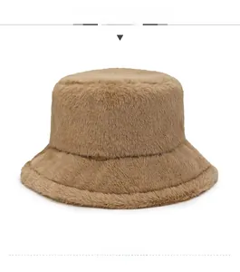 Detail view of thick camel faux fur bucket hat showing plush texture and warm material