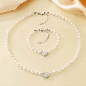 French style pearl jewelry set featuring heart pendants on necklace and bracelet pieces
