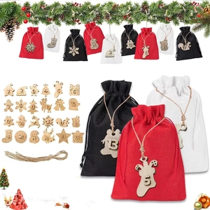 Detail of Christmas advent calendar linen pouches with wooden number tags for holiday countdown