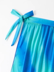 Detail of blue gradient sarong with side-tie closure and breathable semi-sheer fabric