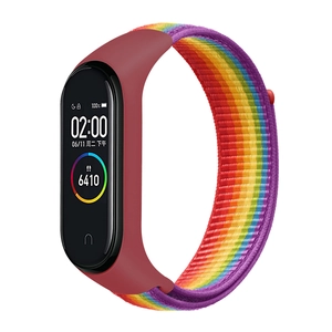 Rainbow nylon loop sport band for Xiaomi Mi Band with red silicone frame at 45 degree angle
