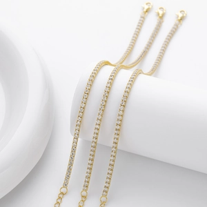 Three gold-tone S925 silver tennis bracelets with cubic zirconia and lobster clasp