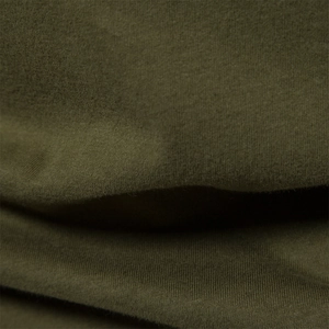 Detailed macro view of the olive green fabric texture on a long-sleeve raglan T-shirt