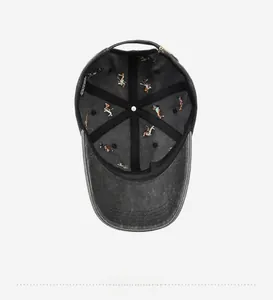 Detail view of washed cotton baseball cap interior with embroidery and metal buckle