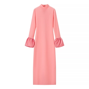 Pink high neck long sleeve dress with puff cuffs shown in a clean flat lay style