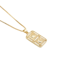 Gold square necklace pendant with engraved star and moon motifs and zircon crystals