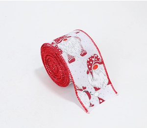 Detail view of red Christmas ribbon featuring gnome prints and glittering festive textures