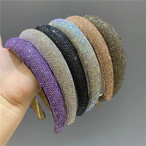 Close-up of sparkling rhinestone padded headbands in various luxury color options