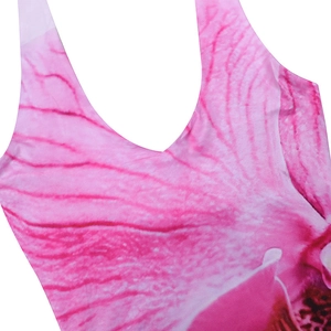 Close-up of pink orchid floral print and textured synthetic fabric on a slim fit dress