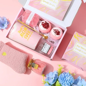 Pink Mother's Day gift set with marble mug, handmade candle, and spa bath salts in a box