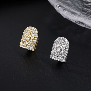 Close-up of hip hop teeth grillz with micro-pave cubic zirconia in gold and silver