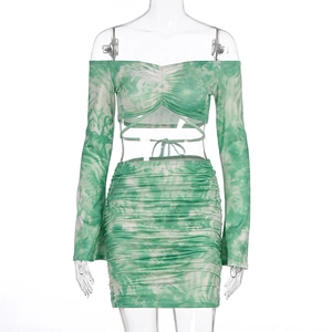 Detail of green marble print two-piece set featuring off-shoulder top and ruched skirt