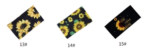 Detailed view of three sunflower printed elastic headbands in black with artistic lettering