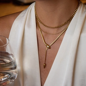 Gold multi-layer necklace set featuring chunky Cuban chain and crystal snake pendant