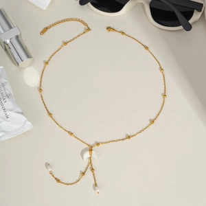 Golden moon pendant necklace with delicate chain, white crescent stone and small pearl