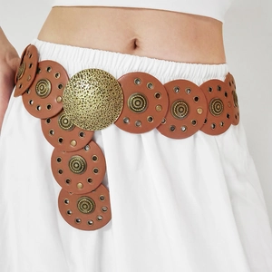 Detail of vintage brown PU leather waist belt featuring round discs and bronze metal buckles