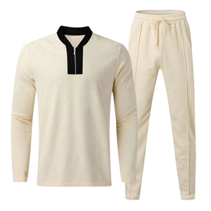 Detail of off-white waffle knit tracksuit with half-zip collar and drawstring waist