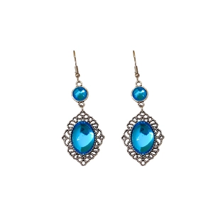 Vintage bohemian silver earrings with oval blue resin stones on a clean white background