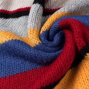 Close-up of the rainbow striped knit fabric showing texture and colorful yarn details