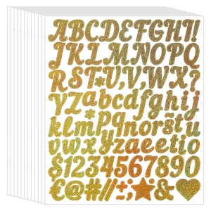 Macro detail of 1-inch glitter alphabet stickers with gold lettering and numeric symbols