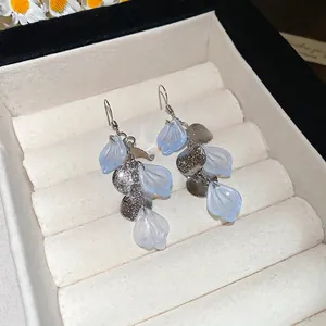 Seaside long tassel shell disc earrings with light blue petals in a jewelry box
