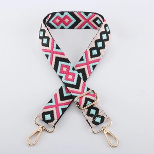 Detail of adjustable geometric strap with colorful diamond pattern and gold metal hooks