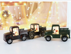 Vintage Christmas truck lanterns with glowing cabin details in three retro colors