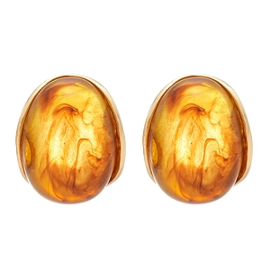 Elegant oval amber resin earrings with minimalist gold metal frame on a white background