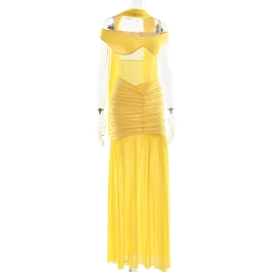 Detail view of yellow off-shoulder long dress featuring mesh panel and ruched tulle texture