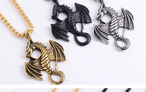 Detail showing dragon relief pendants in gold, black, and silver metallic finishes