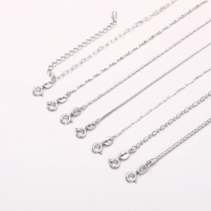 Macro detail of seven assorted silver S925 snake and box chains with spring ring clasps