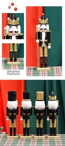 Detailed view of 30cm black and gold wooden nutcracker kings with glitter finish