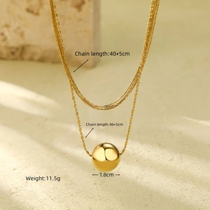 Detail of gold double-layer necklace showing dimensions of 1.8cm polished ball pendant