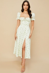 Detail of puff sleeve floral maxi dress with square neck and high front slit design
