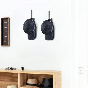 Vertical wall-mounted baseball cap organizer rack with black nylon straps and metal hooks
