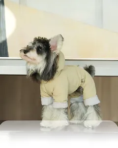 Detail of snap button hood and striped lining on warm waterproof dog winter coat