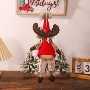 Close-up of a Christmas reindeer plush ornament featuring red knit hat and warm fur collar