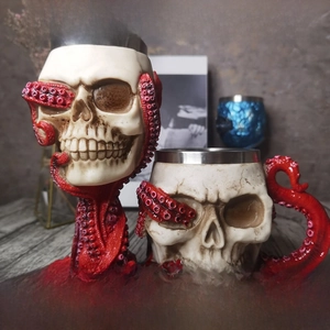 Detail of dragon sword wine goblet with skull design and stainless steel liner