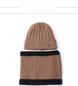 Detail of winter knit hat and neck warmer set with warm fleece lining and leaf patch
