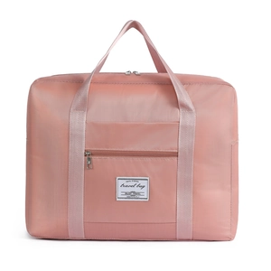 Large capacity pink travel storage bag with wide top handles and waterproof material