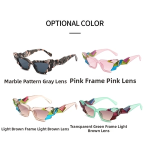 Sculpted cat eye sunglasses with bold geometric facets in marble, pink, and green